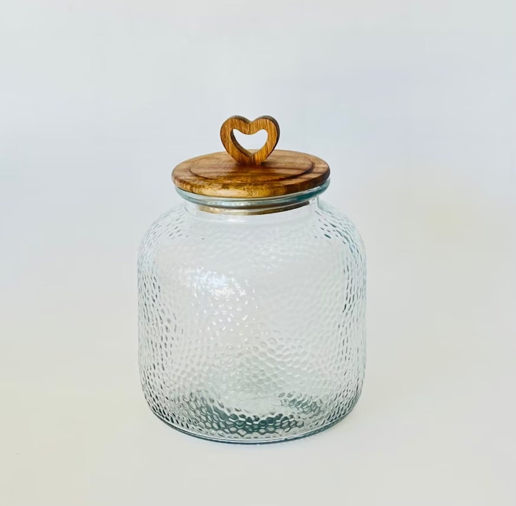 Bote de cristal y acacia con corazón